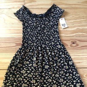 Short black floral sundress with smocking and capped sleeves
